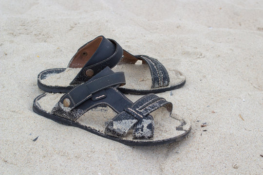 sandals lie on the sand