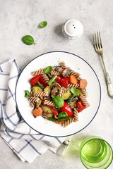 Whole grain pasta with mushrooms and vegetables.Top view.