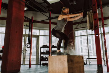 Beautiful young woman training at the gym