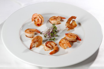 grilled shrimps with on white plate  