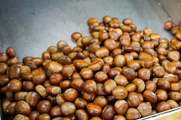 close up fresh roasted chestnuts on street food