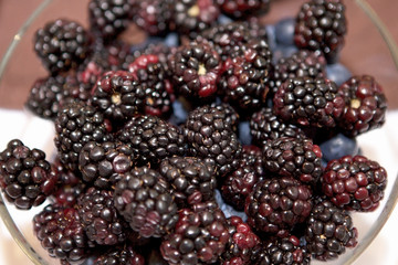 blackberry berries in a glass plate. Berries. Healthy eating.