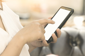 close up of woman's hands holding smartphone with blank copy space screen for put text or content, Modern lifestyle and luxury, Behavior of people in city.