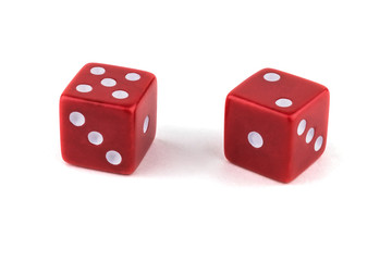 Two red dice, close-up isolated on white background.Five and two.