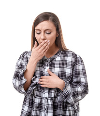 Young woman coughing on white background
