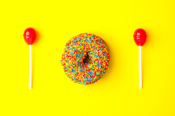 Word lol from sweetness on yellow background. Abbreviation stands for laugh out loud, flat lay trendy background