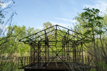 Fototapeta premium Steel construction on a water of lake.