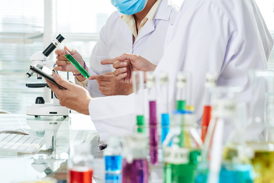 Chemists Carrying out Experiment