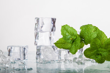 ice cubes and mint leaves isolated on a white background