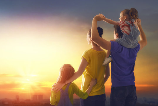 happy family at sunset.