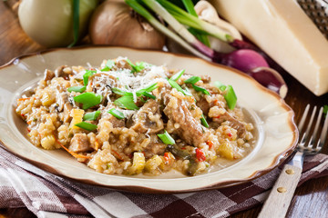 Risotto with champignon mushrooms, pork and parmesan