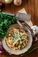 Risotto with champignon mushrooms, pork and parmesan