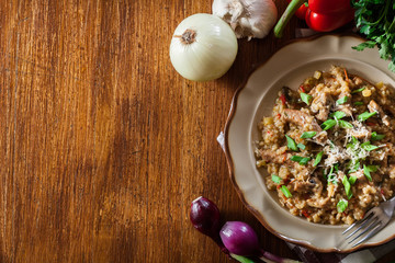 Risotto with champignon mushrooms, pork and parmesan