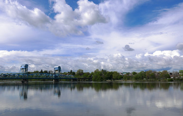 View of blue bridge spanning the snake river with beautiful sky 