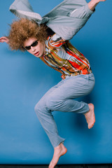 Fashionable guy in stylish clothes from the 90s