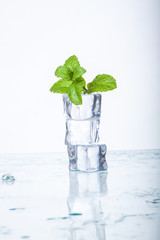 ice cubes and mint leaves isolated on a white background