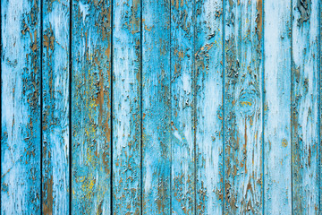 Fototapeta na wymiar Peeling old paint on wooden boards background 