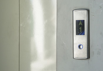 lift with button in the building., steel door lift.