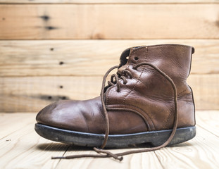 old brown boots isolated on white background.