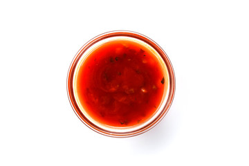 Sauce in a glass bowl on white background (close up)