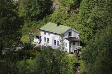 Fototapeta na wymiar Old farmhouse in the forrest Ursfjorden Northern Norway