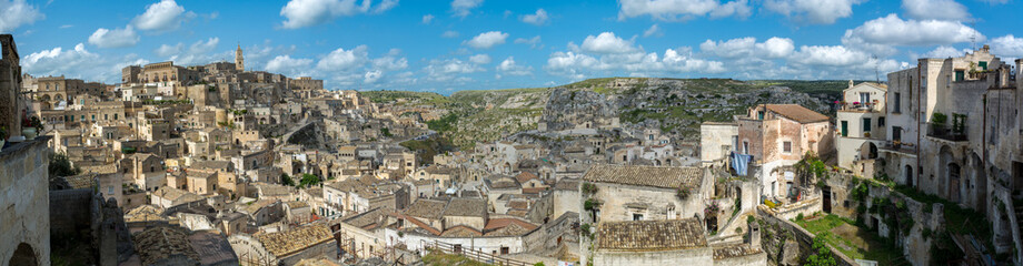 Fototapeta na wymiar Panoramic View of the City of Matera and the Sassi on Blue Sky Background