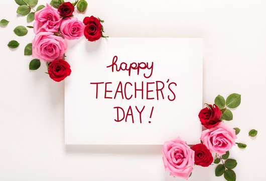 Teacher's Day message with roses and leaves top view flat lay