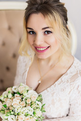 Obraz na płótnie Canvas Beautiful woman in wedding dress in photo studio.