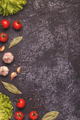 Ingredients for cooking on dark concrete background.