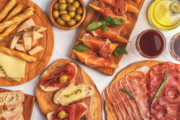 Italian food  background with ham, cheese, olives.
