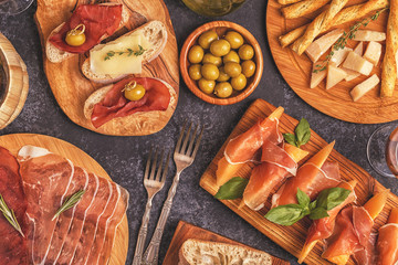 Italian food  background with ham, cheese, olives.