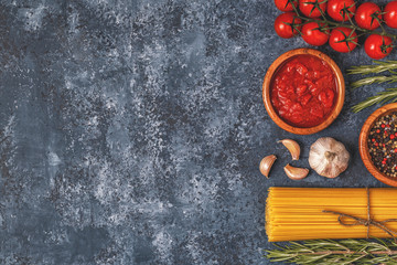 Italian food background with pasta, spices and vegetables.