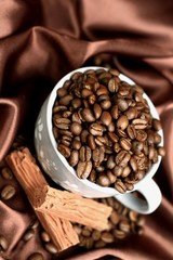 roasted coffee beans in a cup