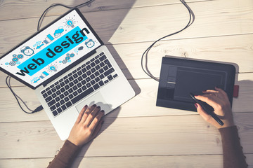 Designer drawing a web design sketch top view