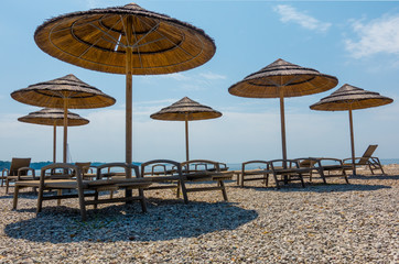 Beach with beach chairs in morning light on the beach