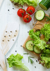 Ingredients cooking for summer salad on a white kitchen table. The concept of nutrition health. Copy space, top view flat lay background.