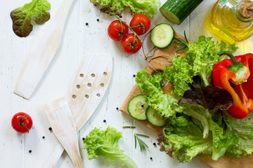 Ingredients cooking for summer salad on a white kitchen table. The concept of nutrition health. Copy space, top view flat lay background.