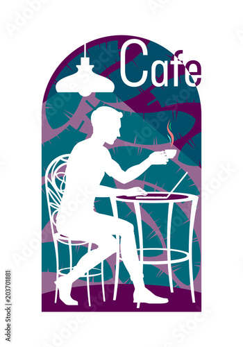 Young Man Sits On A Chair In A Cafe With A Cup Of Coffee