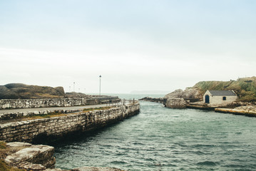 Fototapeta na wymiar Harbor In Northern Ireland - a game of throne filming location
