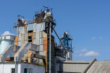 old building of the plant on the sky background