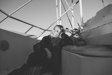 Attractive Model Posing Naturally for camera on Boat Docked in the Bay