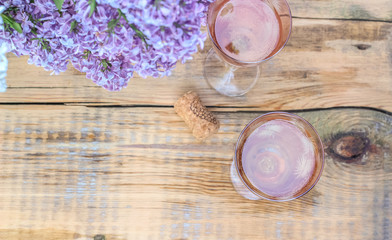 Table setting with chilled white wine and glasses alfresco. Top view. Copy space