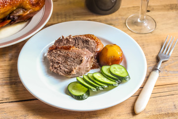 Homemade Roast Duck and wine in a glasses. Crispy whole roast duck. Thanksgiving or Christmas Dinner. Selective focus