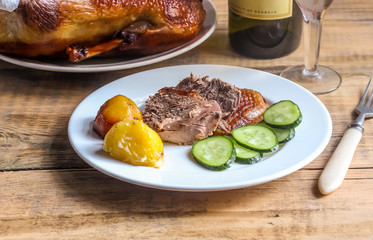 Homemade Roast Duck and wine in a glasses. Crispy whole roast duck. Thanksgiving or Christmas Dinner. Selective focus