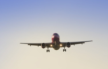 big commercial airplane at landing with clear blue sky background