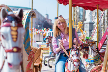 Obraz premium Happy smiling fashionable plus size young woman in modern city life. Life of xl lady. Concept of positive lifestyle. Pretty stylish girl at city center 