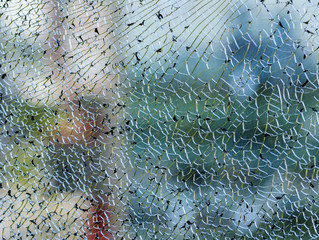 Broken glass, light reflection on a broken window