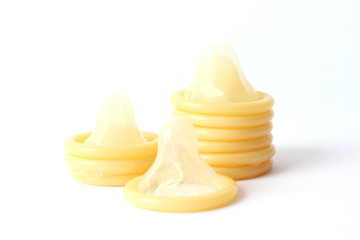 many condoms isolated on white. protection, safe sex