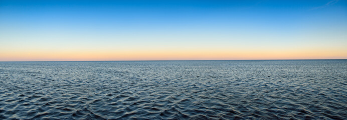 Panorama of sea waves on the background of dawn