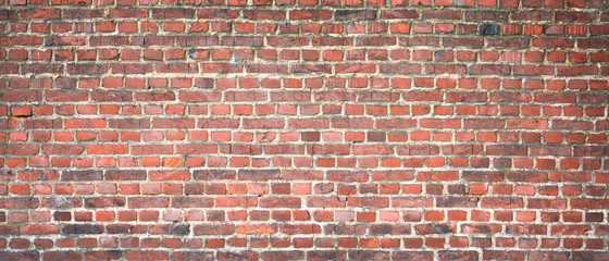 Old red brick wall as background or texture